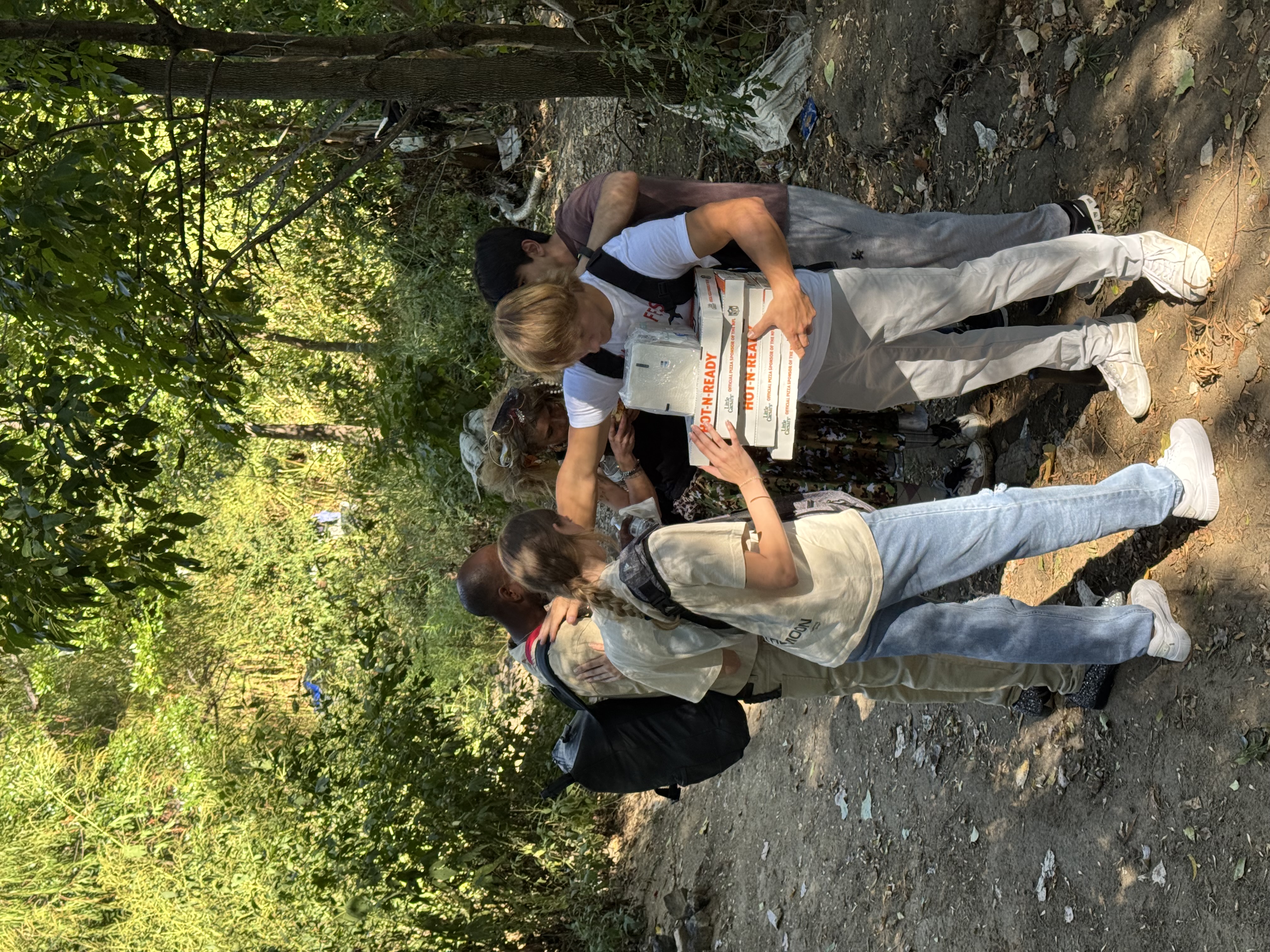 Group prayer with homeless individuals